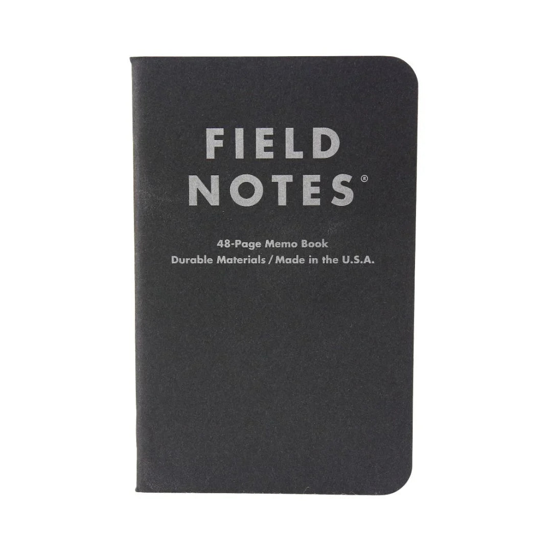 Recycled Firefighter Field Notes notebook with black graph paper, featuring a compact design and durable cover for note-taking.