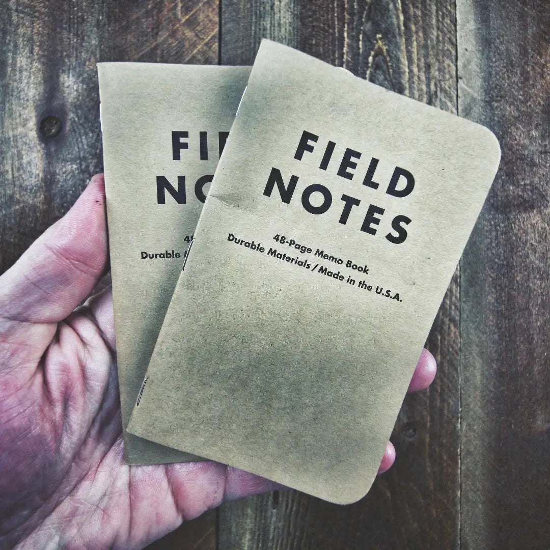 Recycled Firefighter Field Notes notebook with graph paper, compact and durable for sketching and note-taking.