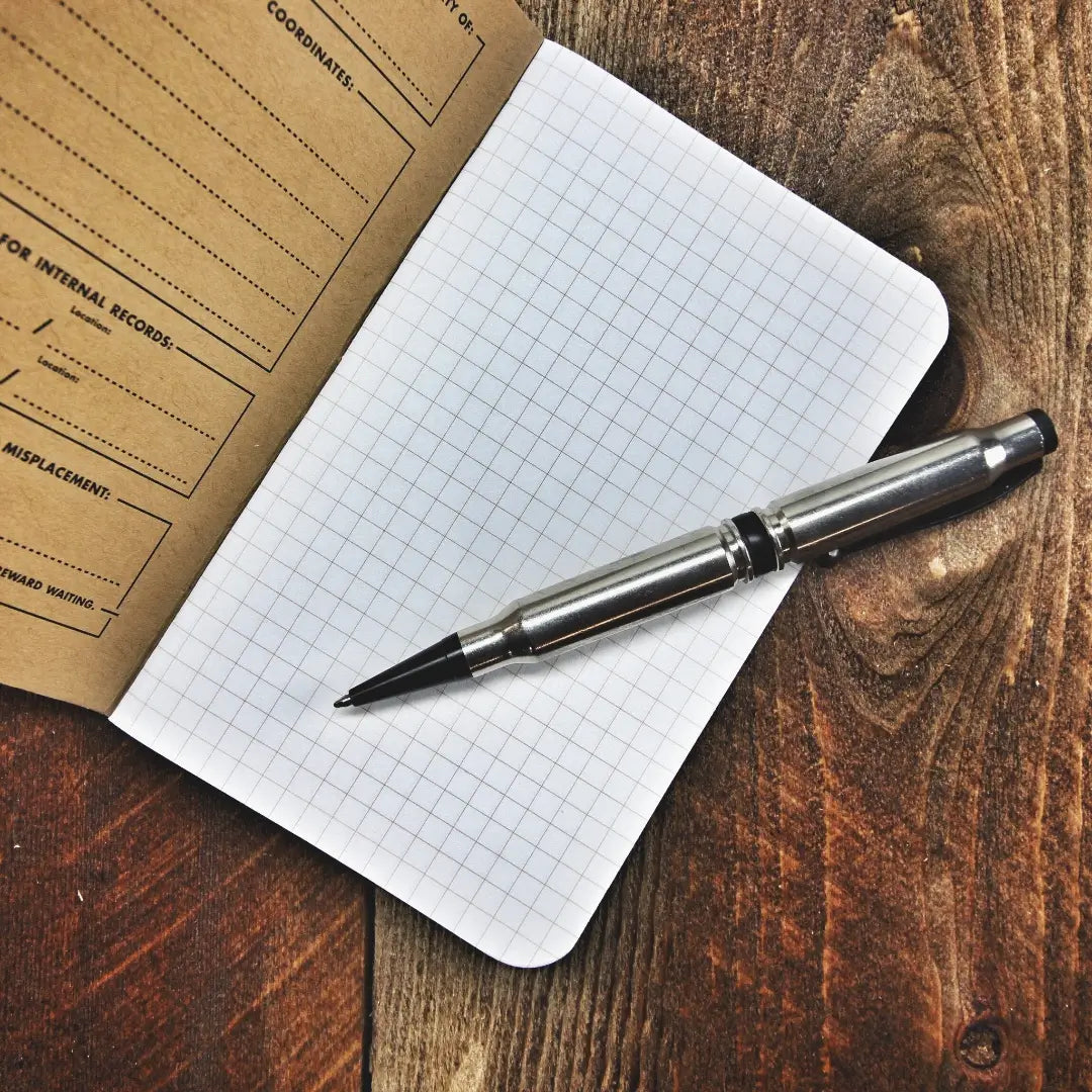 Recycled Firefighter Field Notes notebook with graph paper, featuring a durable cover and compact design for jotting ideas.