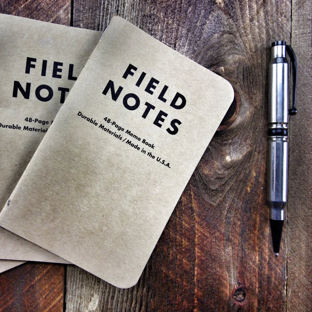 Recycled Firefighter Field Notes notebook with graph paper, portable size, featuring a durable cover and spiral binding.