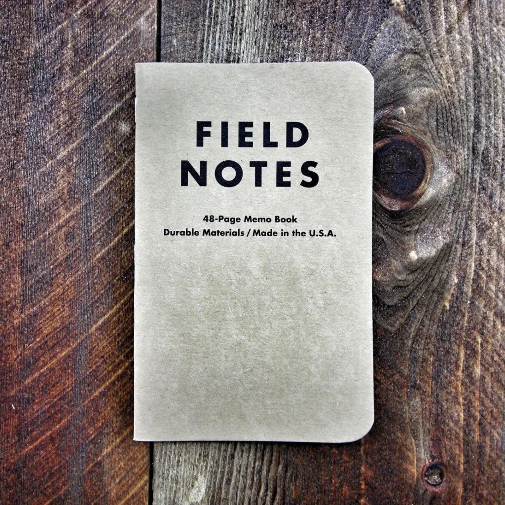 Recycled Firefighter Field Notes notebook with graph paper, featuring a black cover and spiral binding for easy note-taking.