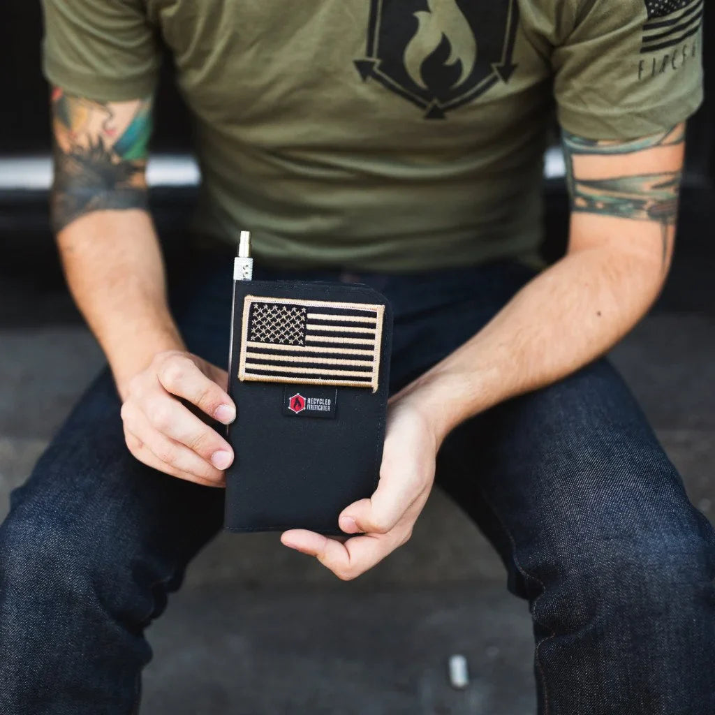 Black Recycled Firefighter Field Notes Wallet made of durable Hypalon material, designed for compact storage and everyday use.