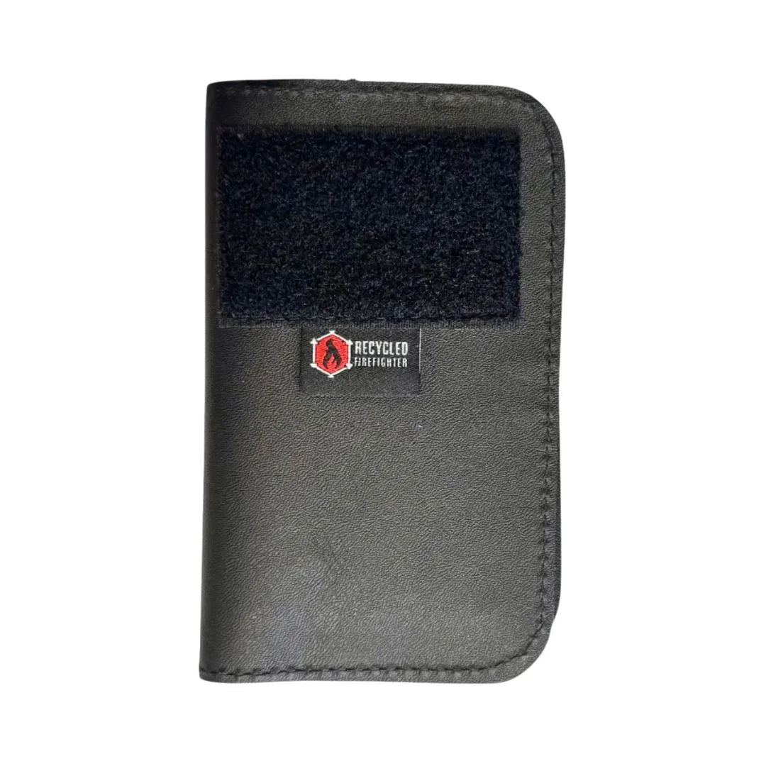 Black leather Field Notes Wallet by Recycled Firefighter, featuring compact design and eco-friendly recycled materials.