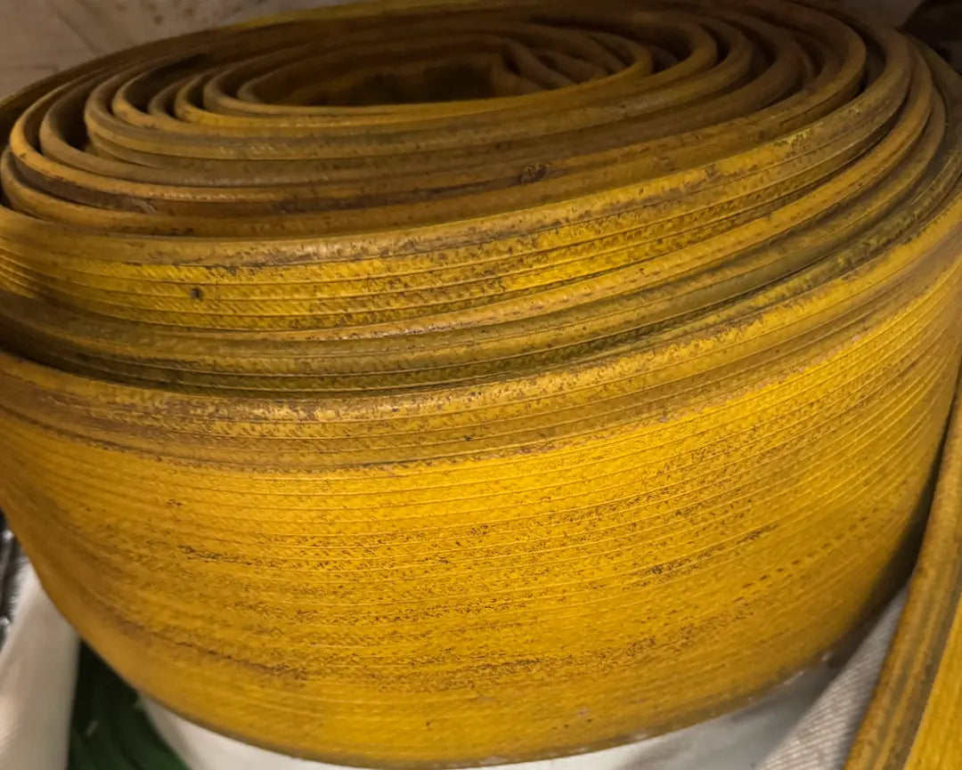 Set of Recycled Firefighter Fire Hose Coasters – Supply Line Edition, featuring durable, vintage-style fire hose design.