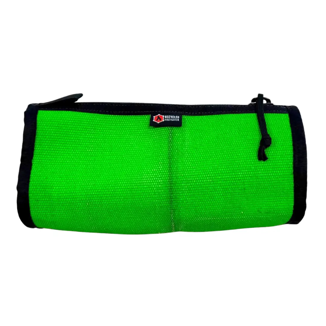 Green fire hose dopp kit by Recycled Firefighter, durable leather toiletry bag with rugged firefighter-inspired design.