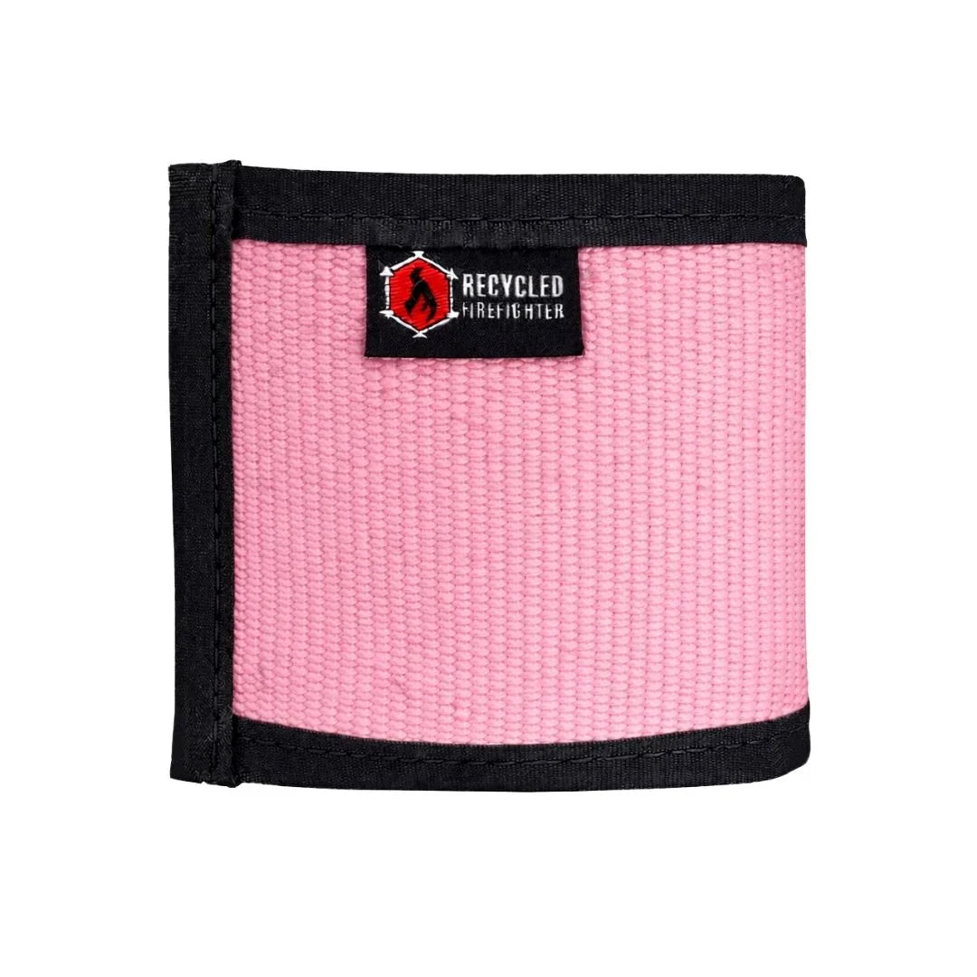 Pink fire hose drink sleeve by Recycled Firefighter, designed to keep beverages insulated and showcase a rugged firehose pattern.