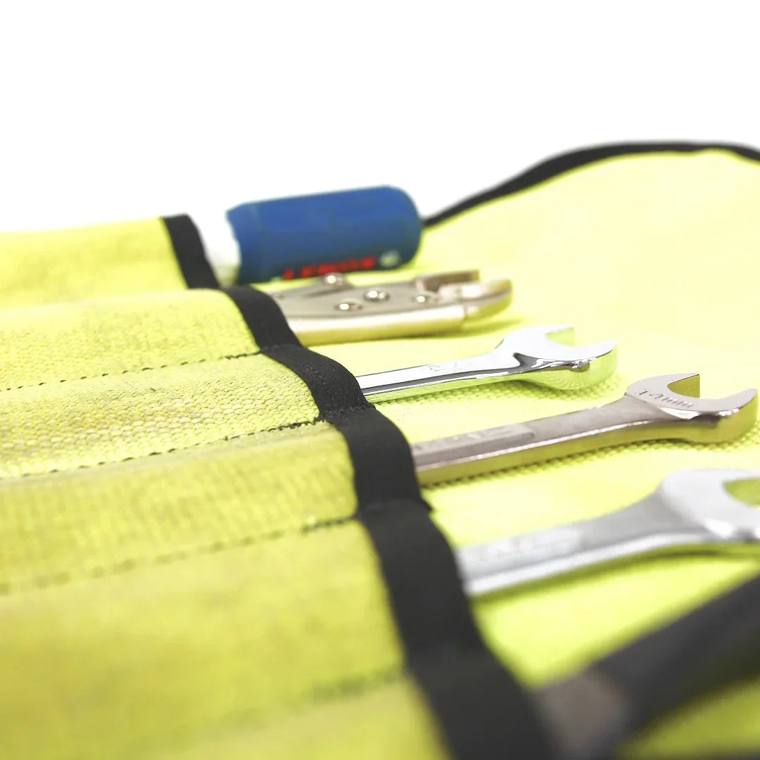 Vintage yellow Recycled Firefighter fire hose tool roll with multiple compartments for storage and organization.