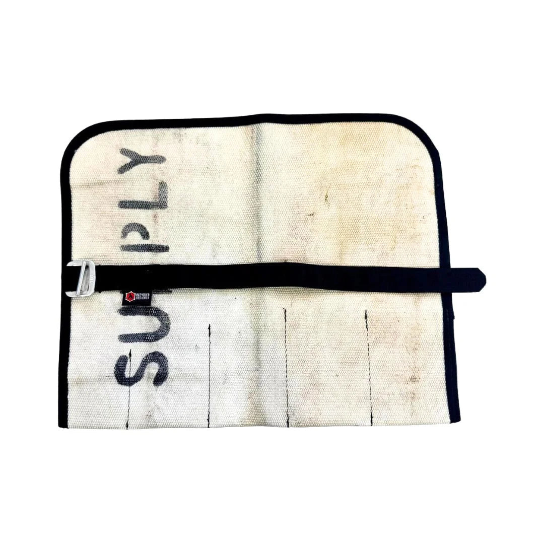 Recycled Firefighter vintage white fire hose tool roll with multiple compartments for organizing firefighting tools.