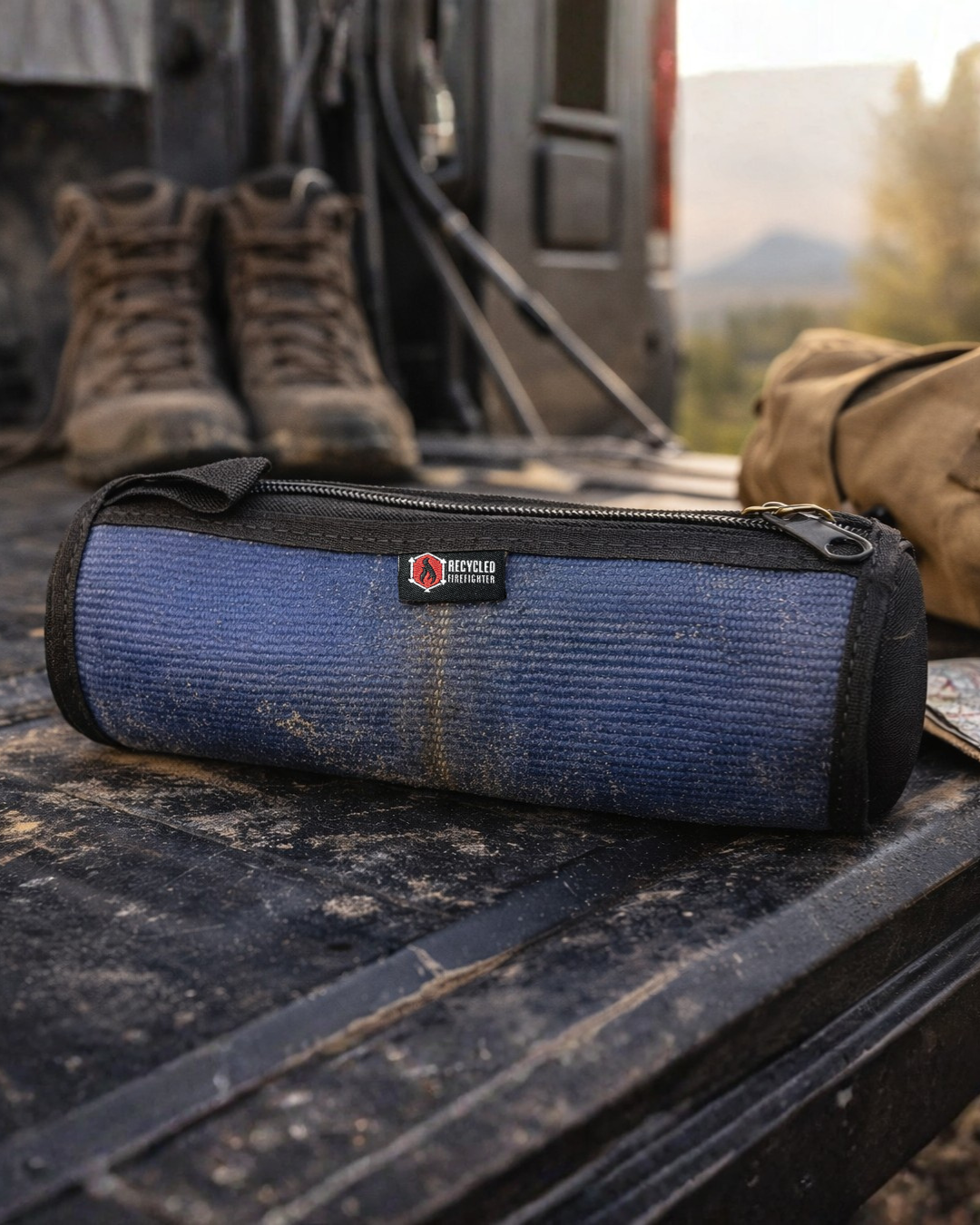 Recycled Firefighter fire hose dopp kit with rugged fabric and zipper closure, designed for travel and organization.