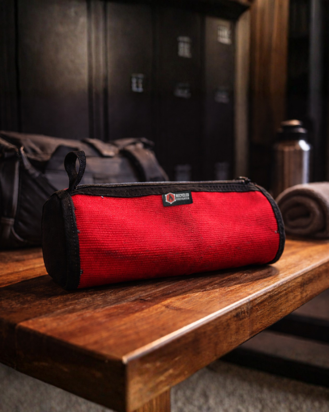 Recycled Firefighter fire hose dopp kit with durable fabric and zipper closure, designed for travel and organization.