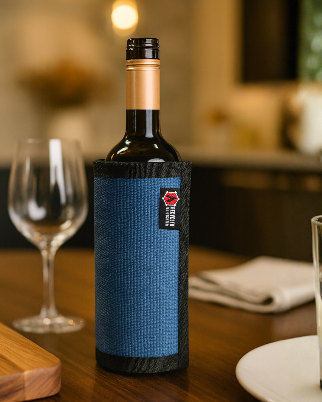 Blue Firehose Wine Bottle Cover by Recycled Firefighter, made from recycled firehose material, fits standard wine bottles.