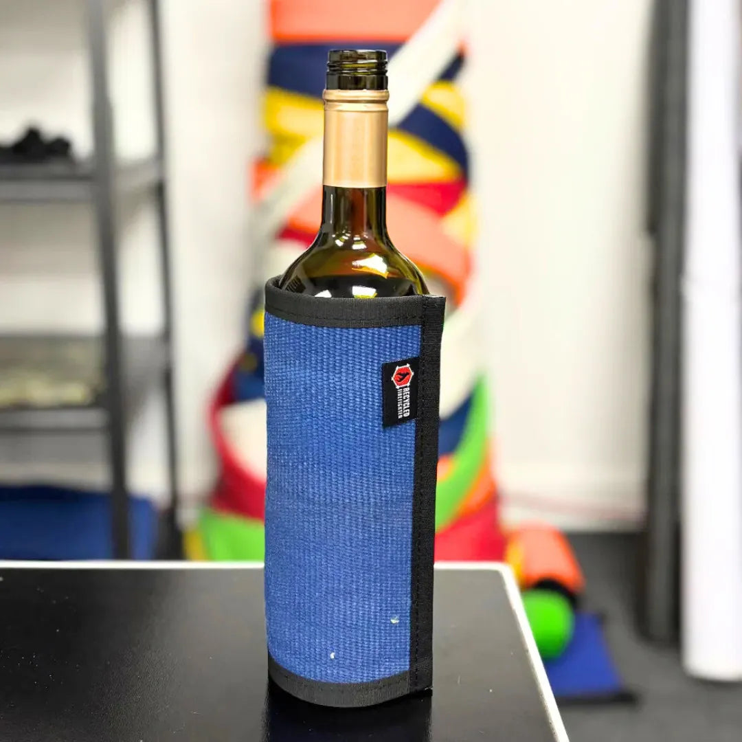Blue Firehose Wine Bottle Cover by Recycled Firefighter, made from recycled firehose material, designed to protect and insulate wine bottles.