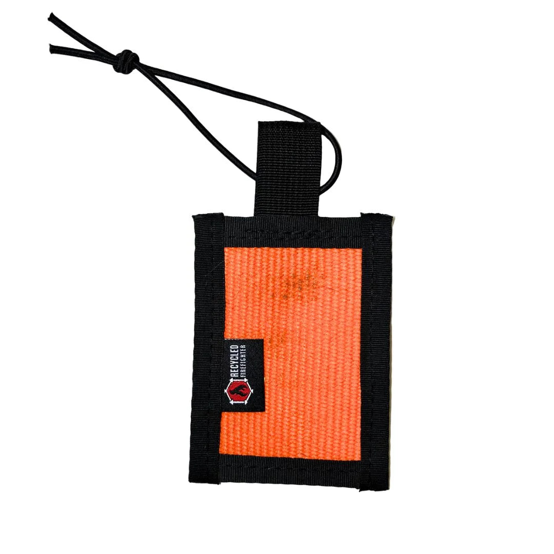 Orange Firehose Luggage Tag by Recycled Firefighter, durable rubber tag with firehose design for easy baggage identification.