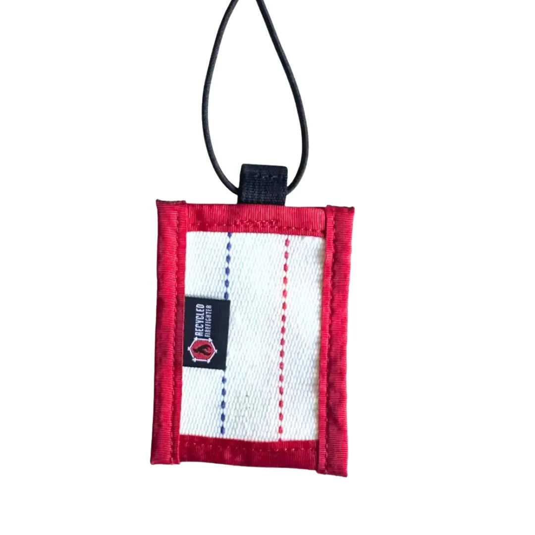 Red, white, and blue Firehose Luggage Tag by Recycled Firefighter, featuring a firehose design on durable material.
