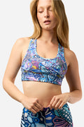 Gray FisheWear Enchanted Grayling Sports Bra with supportive design, shown on a model during a studio photo shoot.