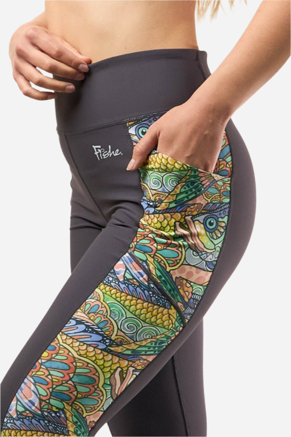 FisheWear Tropical Tarpon Pocket Leggings featuring vibrant tropical fish design and functional pockets, close-up view of fabric detail.