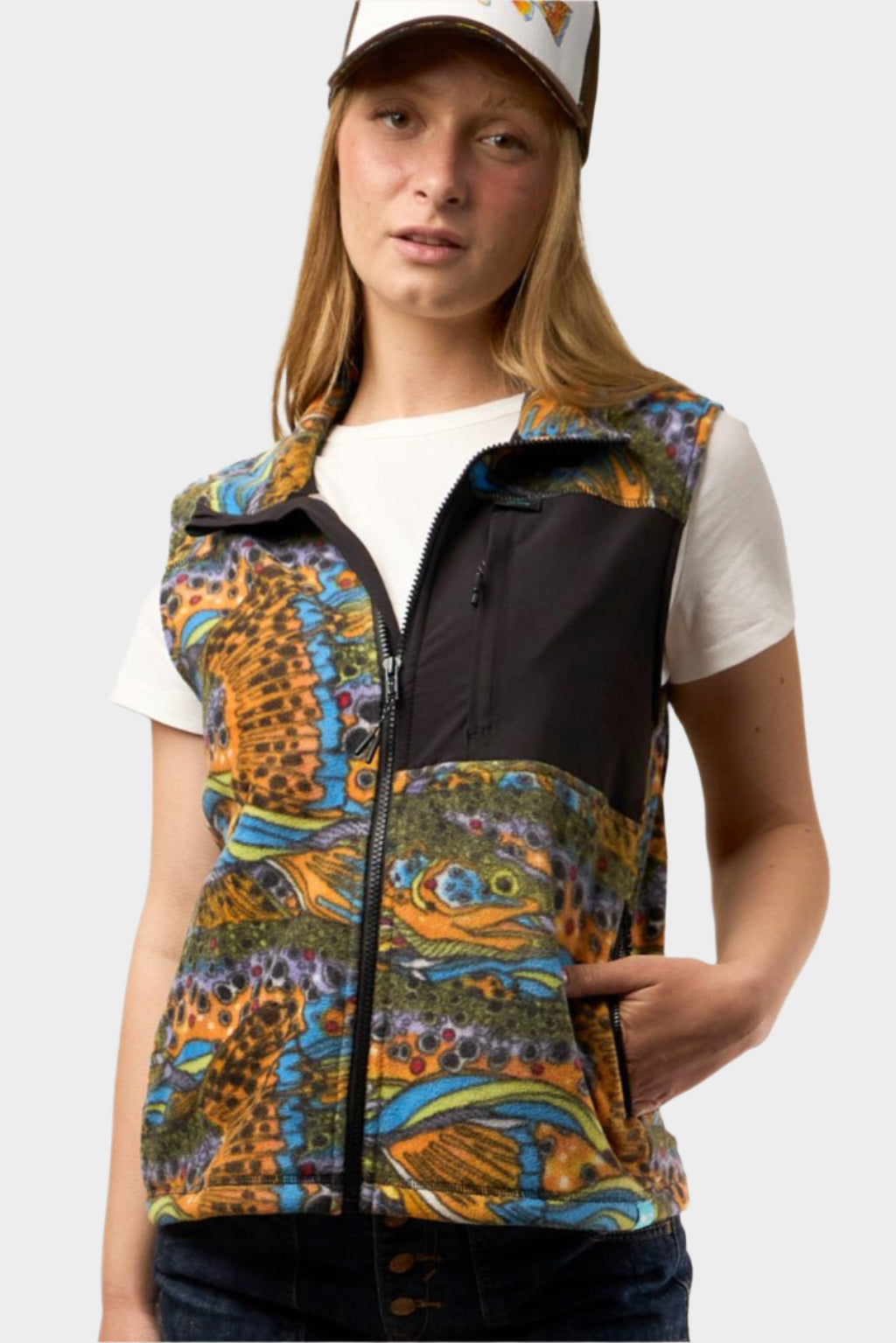 FisheWear unbound brown fleece vest with a soft, cozy texture, displayed on a hanger against a neutral background.