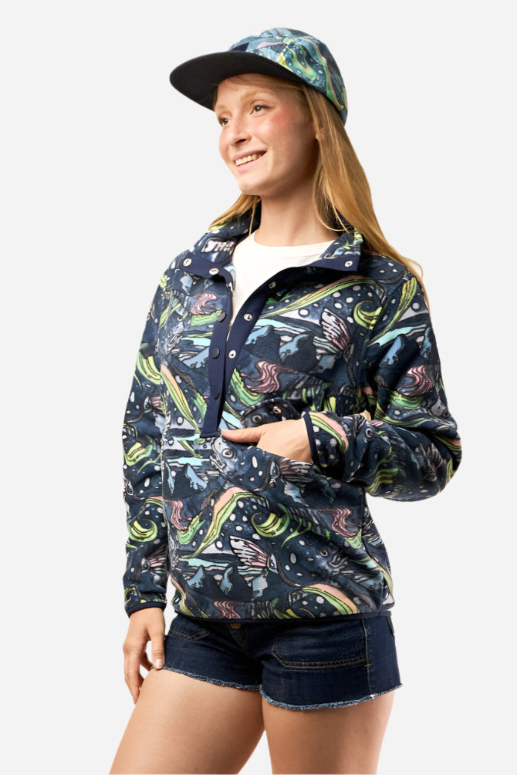 FisheWear HaliBorealis Riffle Snap Fleece in navy, soft fleece fabric with snap front, displayed on a hanger.