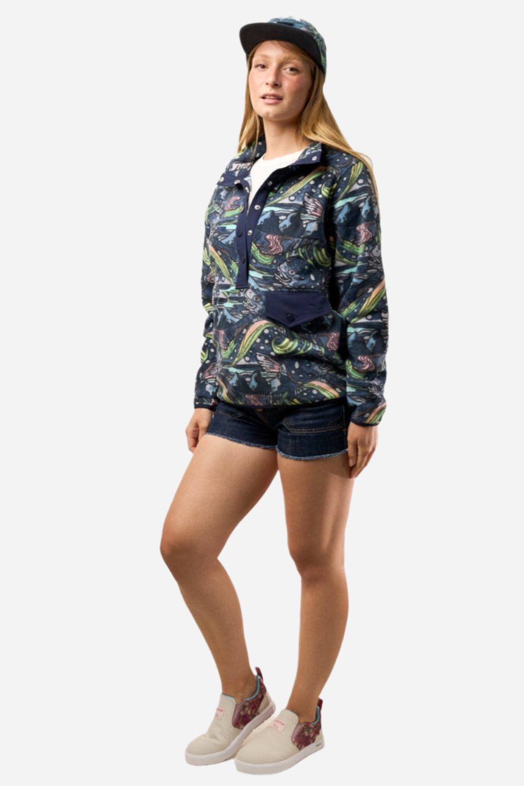 FisheWear HaliBorealis Riffle Snap Fleece in navy, soft fleece fabric with snap buttons, displayed on a hanger.