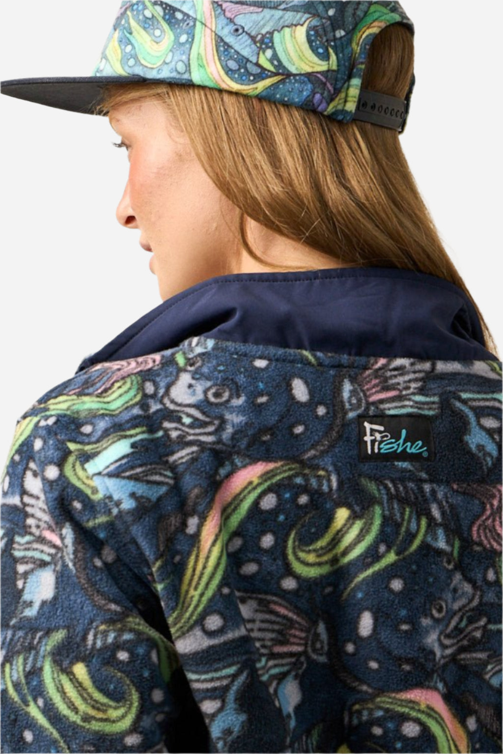 FisheWear HaliBorealis Riffle Snap Fleece, cozy fleece jacket with snap buttons, in a studio setting.