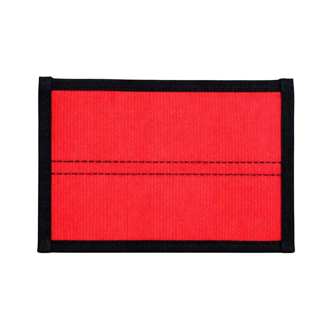Flat EDC pouch in red and black, made from recycled firehose, featuring a zippered closure by Recycled Firefighter.