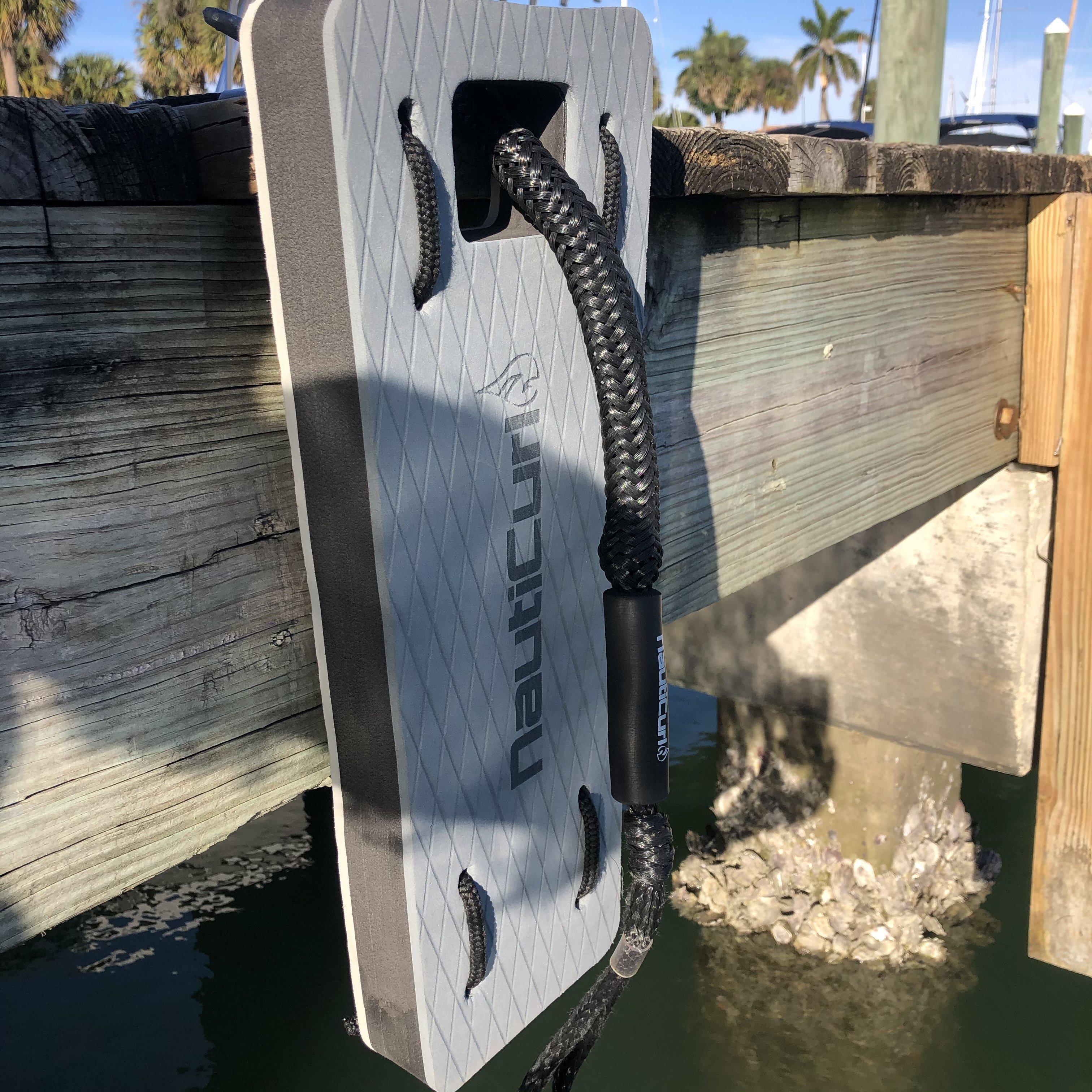 NautiFender flat boat fender from NautiCurl LLC, showing a durable, rectangular boat bumper with attachment points for dock protection.