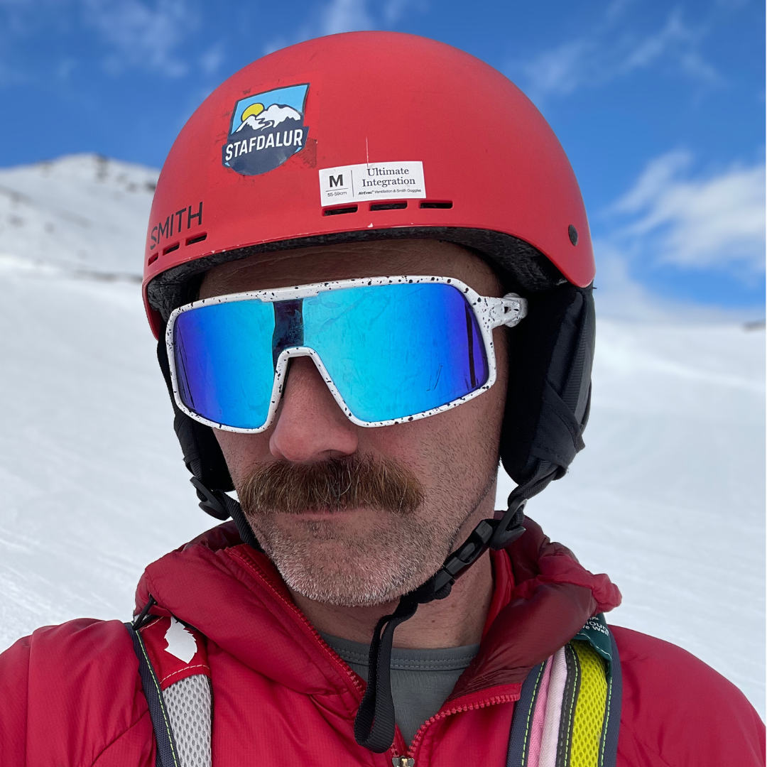 Flying Dog Snowstorm sunglasses with blue-mirror Revo lenses by Eastern Outer, showcasing stylish sunglasses with reflective blue lenses.