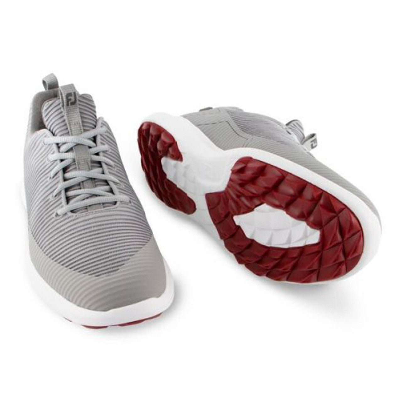 FootJoy Flex XP golf shoes in black with white accents, featuring a sleek athletic design and breathable uppers.