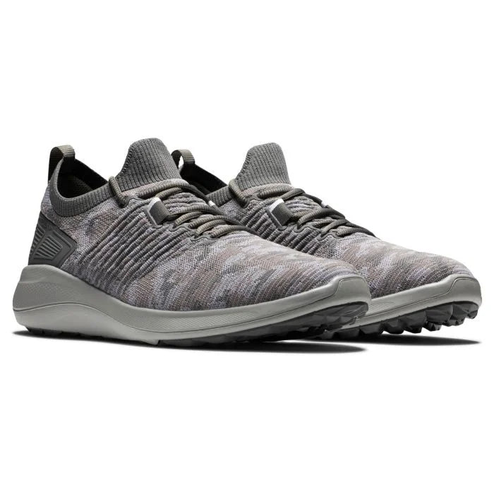 FootJoy Flex XP golf shoes in black and white, featuring sporty design, breathable upper, and durable sole for comfortable golf play.