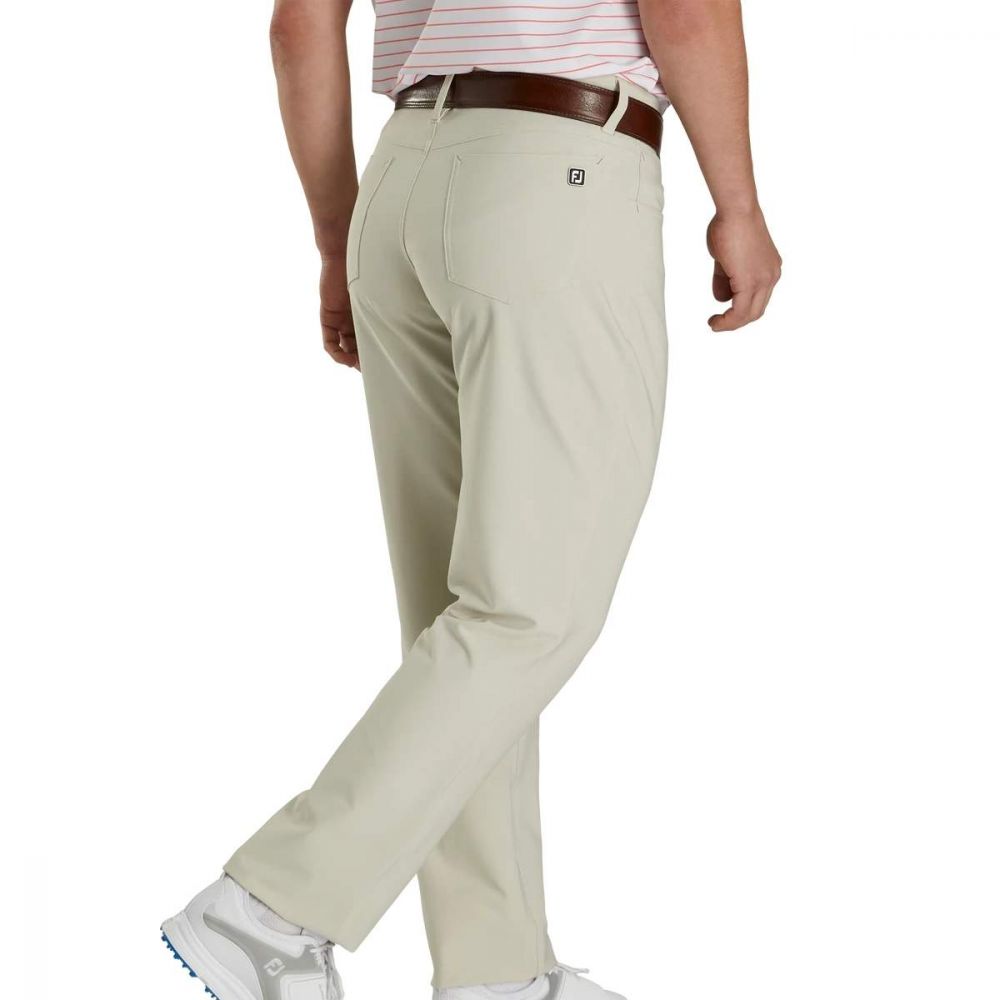FootJoy men's 5-pocket stone golf pants in beige fabric, showing front view with pockets and clean stitching.