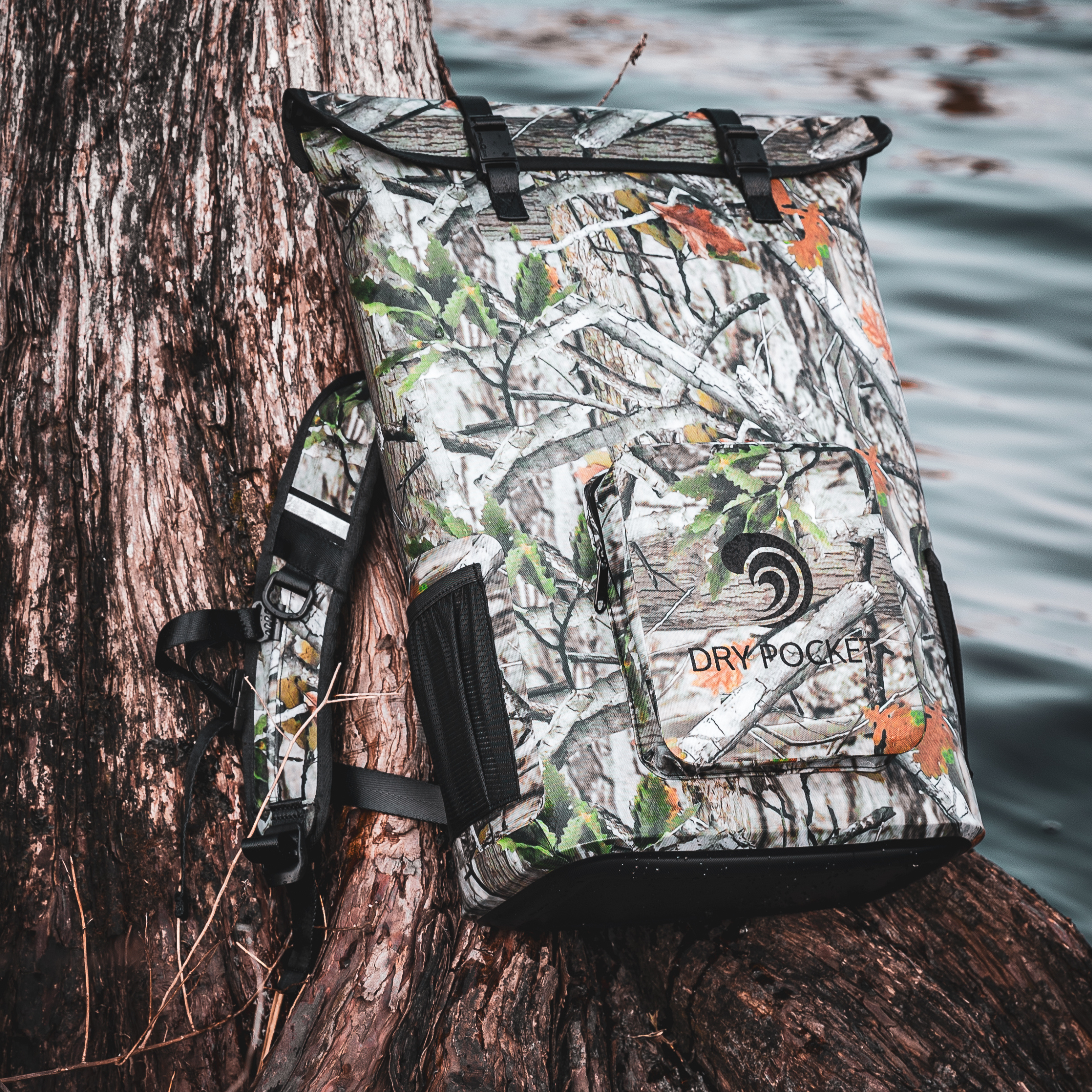 Forest camo waterproof floating backpack cooler by Dry Pocket, featuring adjustable straps and insulated interior for outdoor adventures.