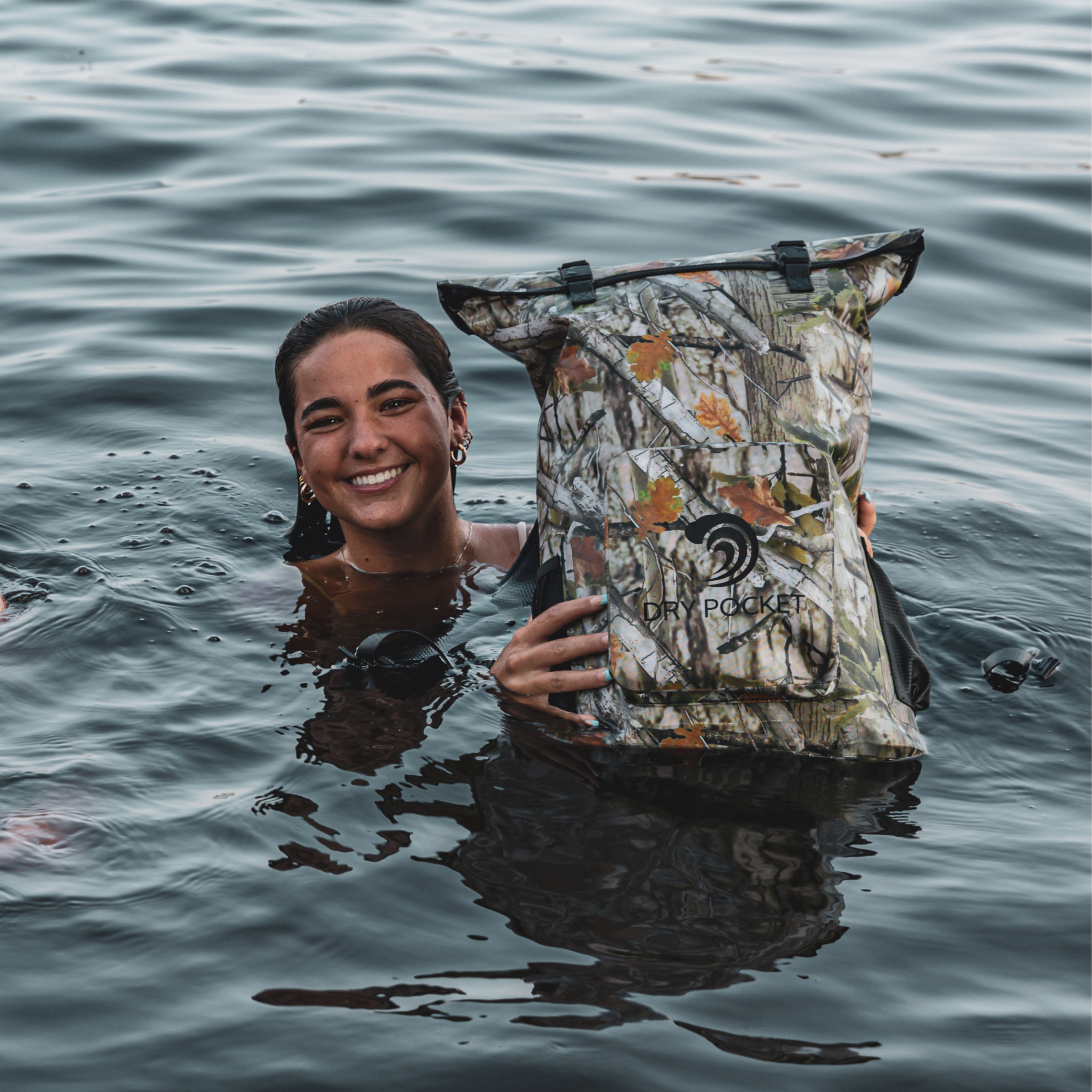 Forest camouflage waterproof floating backpack dry bag from Dry Pocket, ideal for outdoor adventures and water-resistant storage.