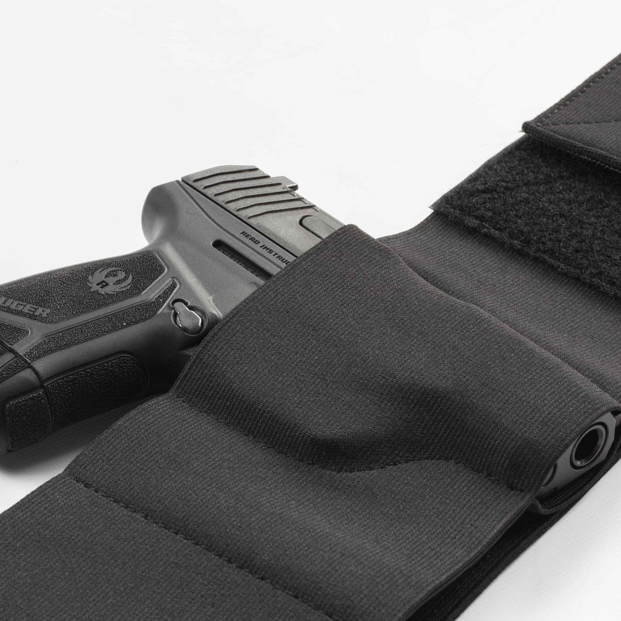 Elite Survival Systems Core-Defender belly band holster with concealed carry design, shown on a person for secure firearm concealment.
