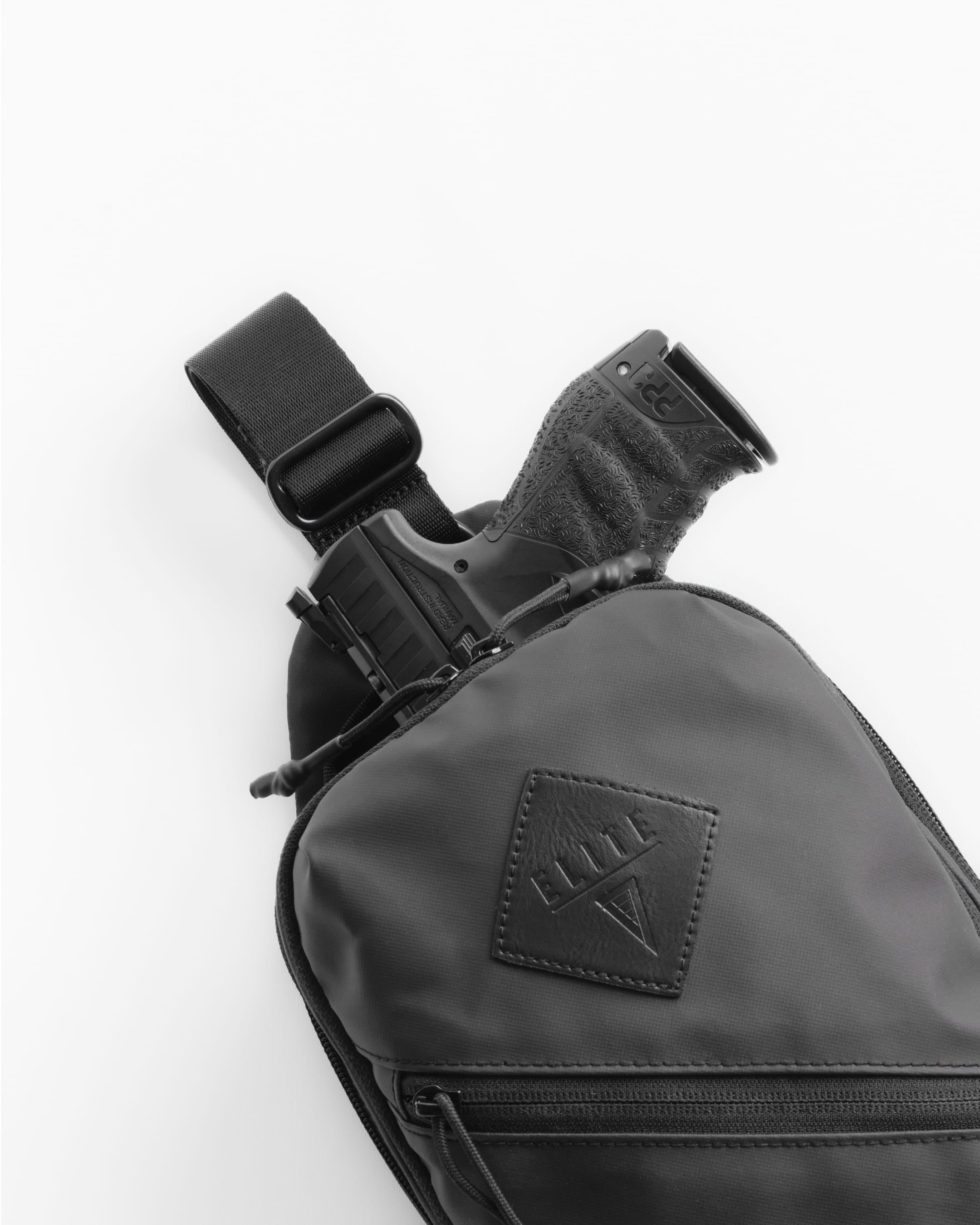 Elite Survival Systems SENTINEL concealed carry sling pack with adjustable strap and multiple compartments for secure storage.