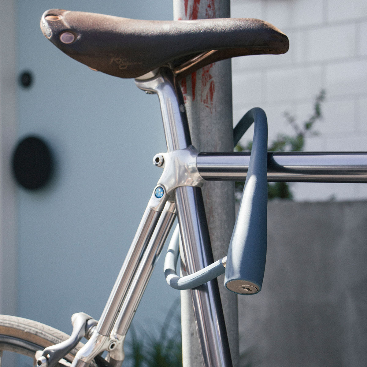 Knog Frankie Cable Lock by ZEITBIKE, a durable black bike lock with coiled cable design and key mechanism for security.