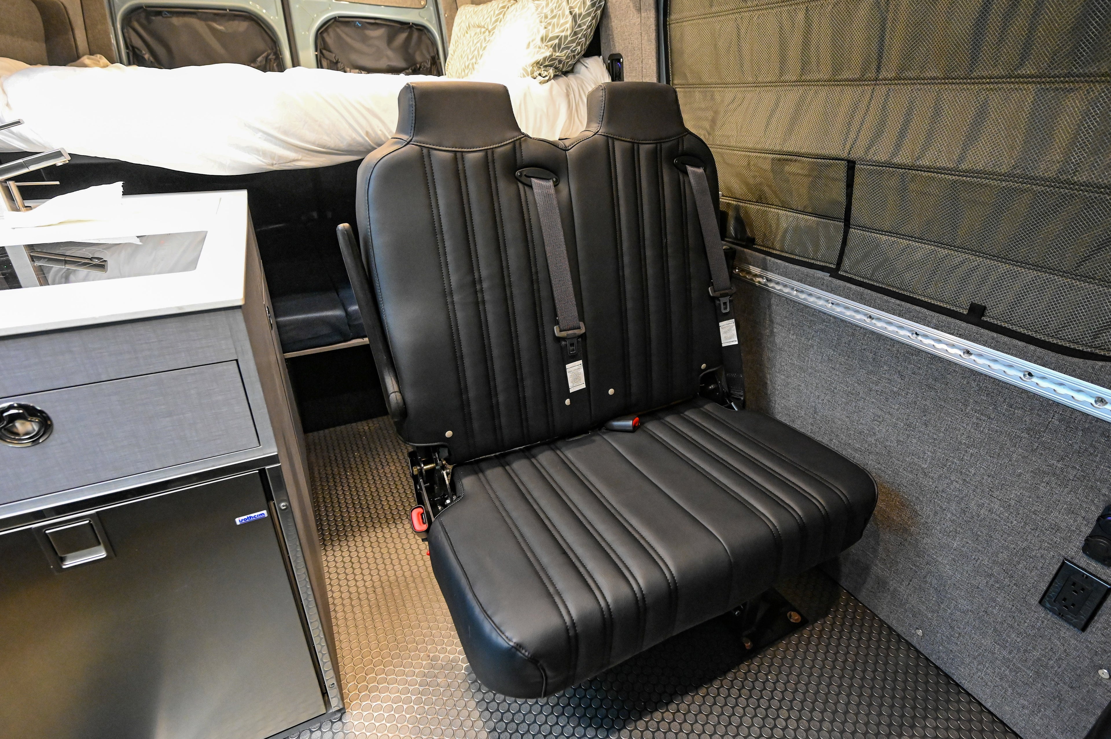 Alpine Van Works Hide N' Go Seat, versatile seating solution with compact design for vehicle or home use.