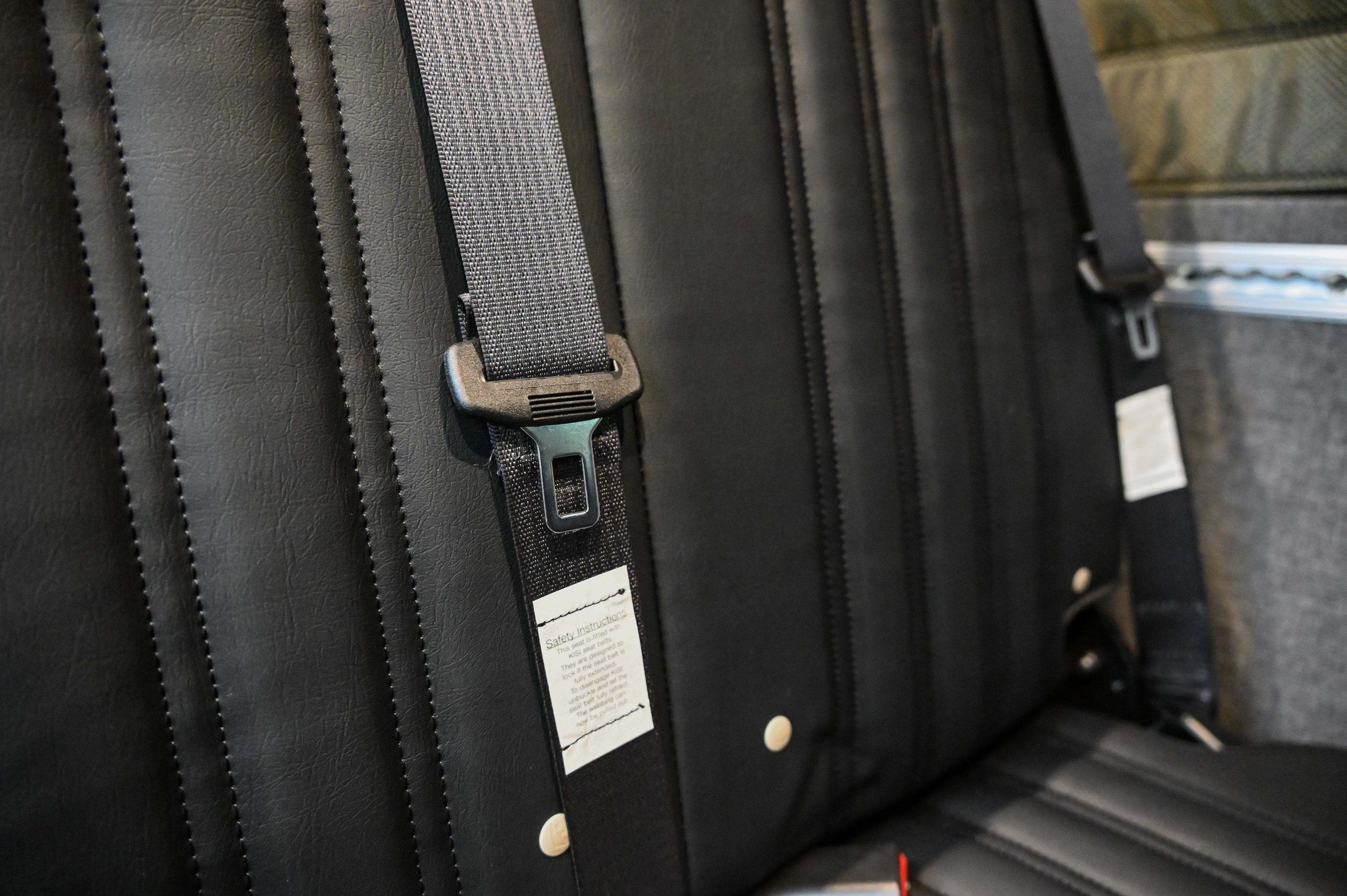 Alpine Van Works Hide N' Go Seat, a versatile seating solution with foldable design, shown in a neutral setting.
