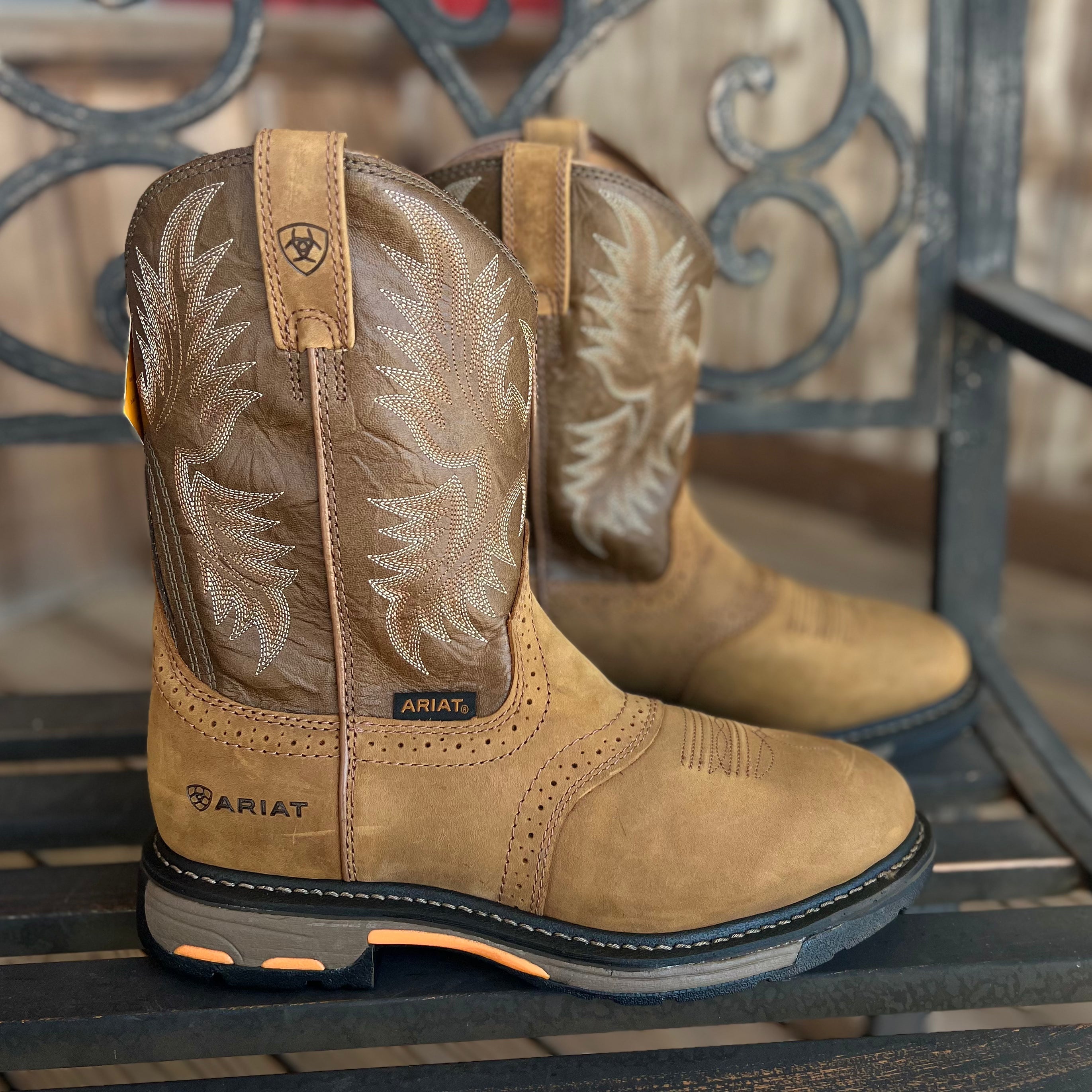 A pair of Ariat Workhog round toe work boots for men, featuring sturdy leather construction and rugged outsole.