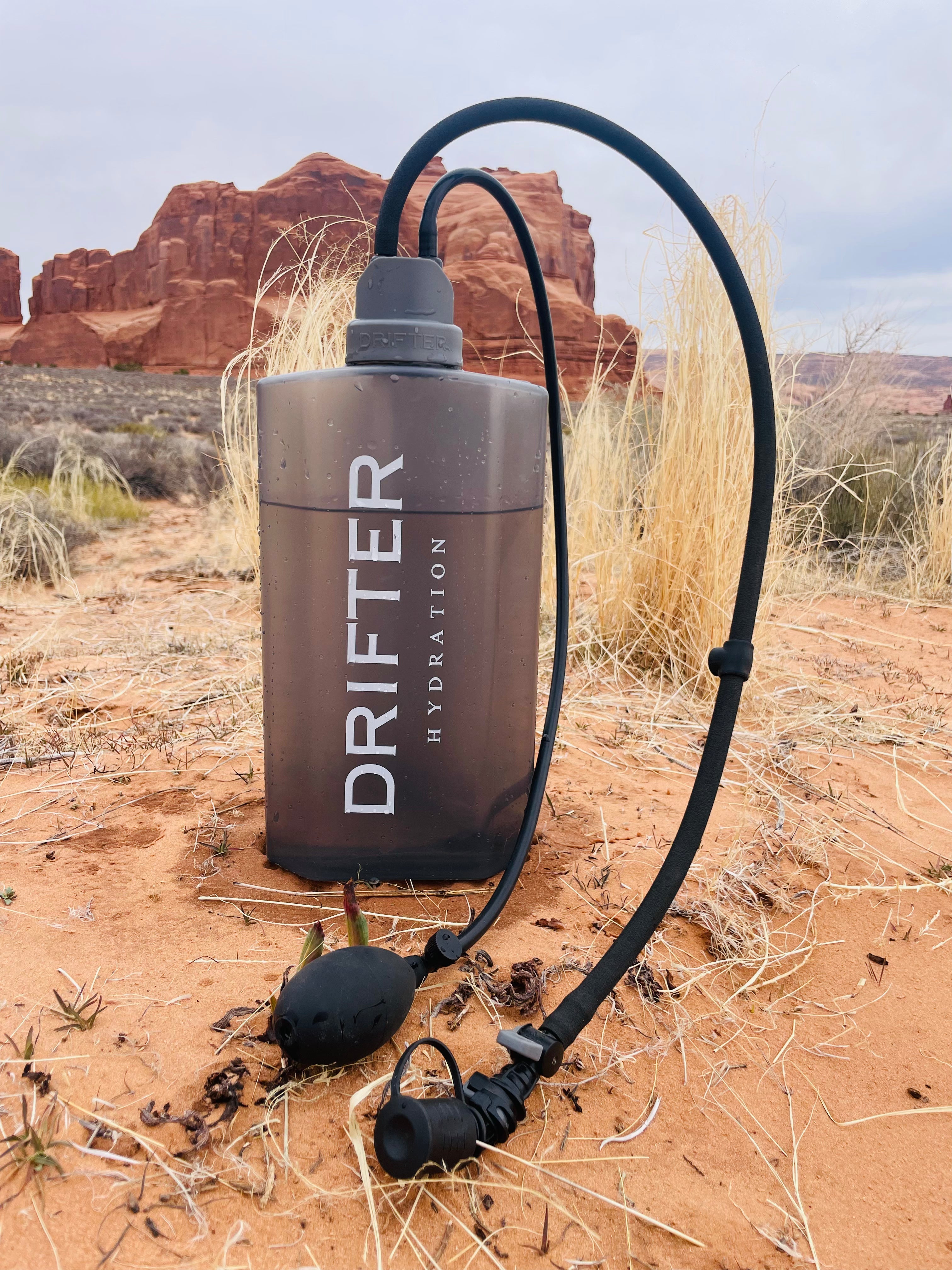Drifter Hydration Lite Hydration System with a clear reservoir, adjustable straps, and ergonomic design for easy carrying.