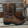 Ariat Heritage Roper men's cowboy boots with brown leather, Western stitching, and classic Western style on a neutral background.