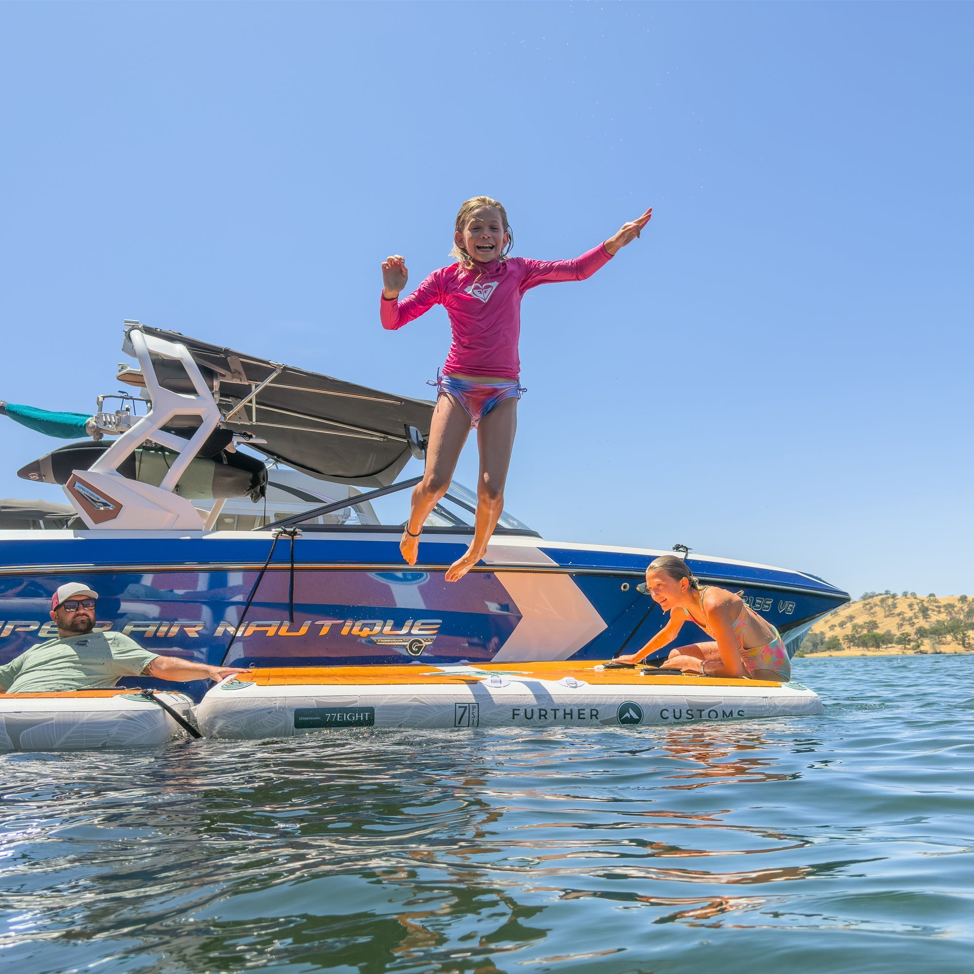 Inflatable Avalon Dock by Further Customs floating swim platform on Tulloch Lake with Canon Ball in the background.