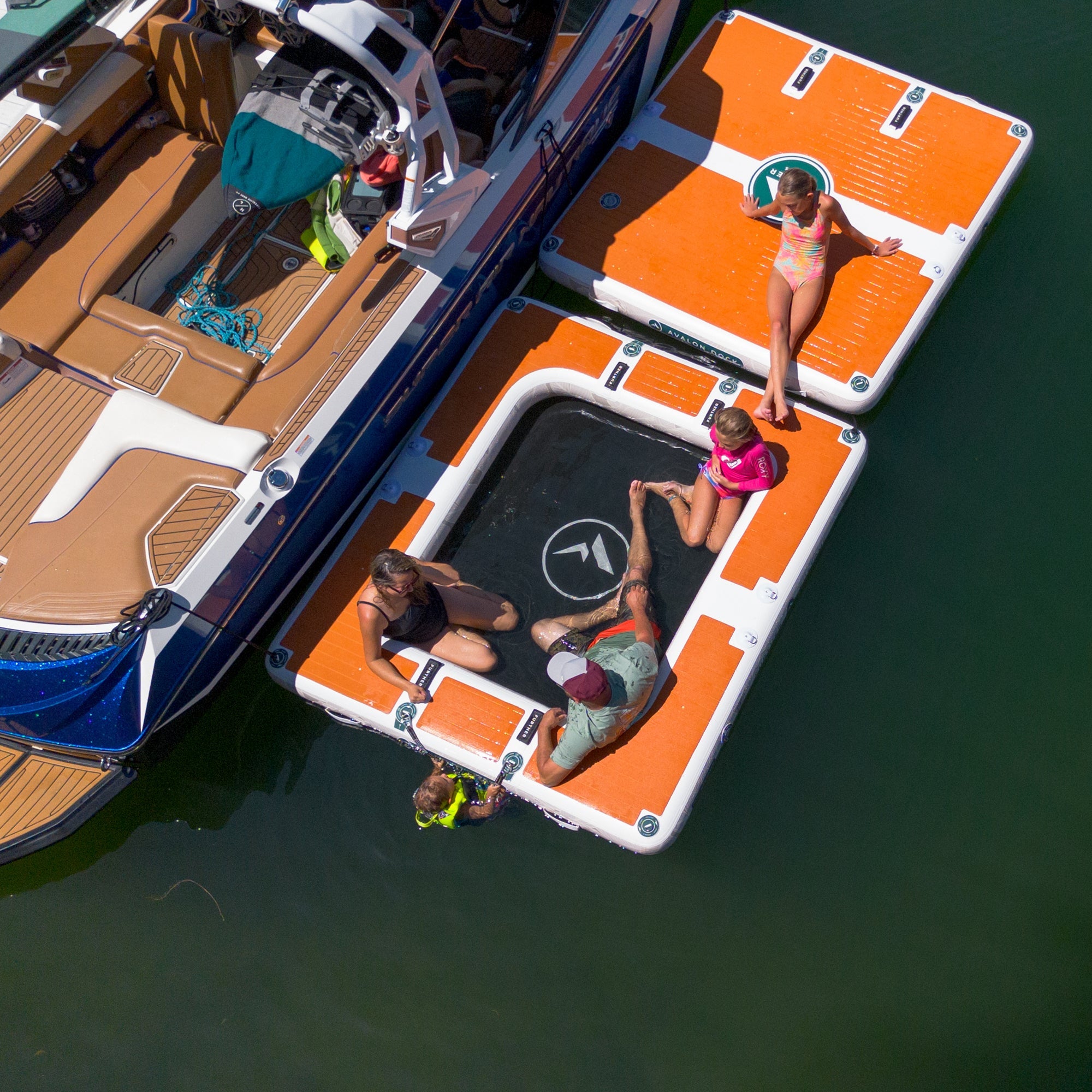Further Customs Avalon Dock water hammock and inflatable swim platform floating on Tulloch Lake, ideal for relaxing and swimming.