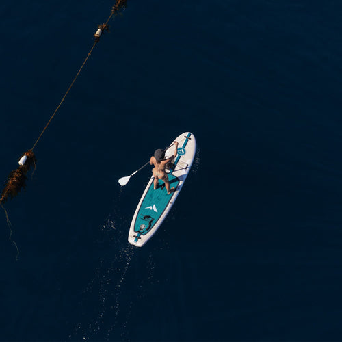11'0 Further Customs Avalon Emerald inflatable paddleboard on a beach with clear water and scenic Catalina Island backdrop.
