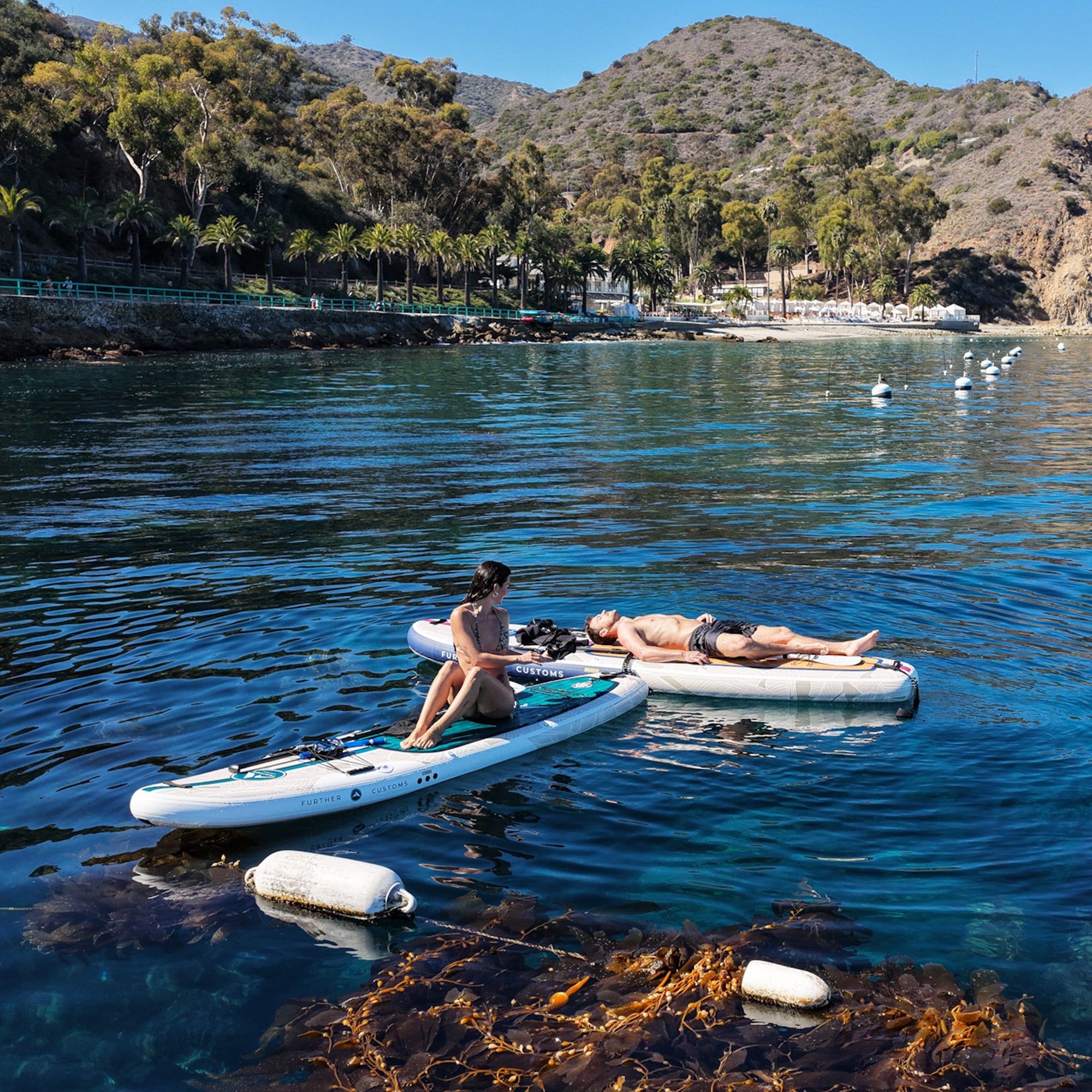 11'0 Further Customs Avalon Emerald inflatable paddleboard with scenic Catalina Island background at Descanso Beach.