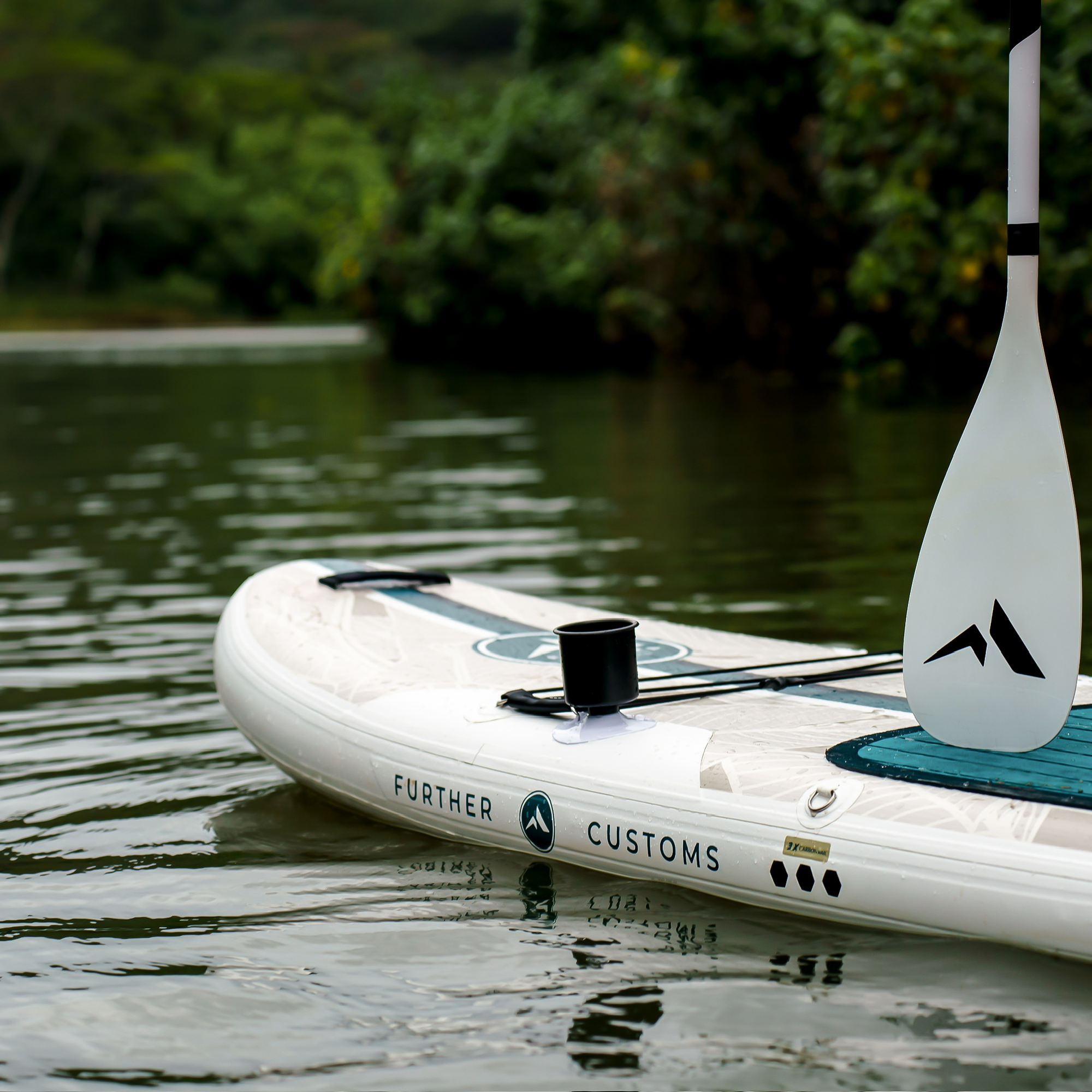11'0 Further Customs Avalon Emerald inflatable paddleboard with Kauai Cup attachment on a sunny outdoor background.