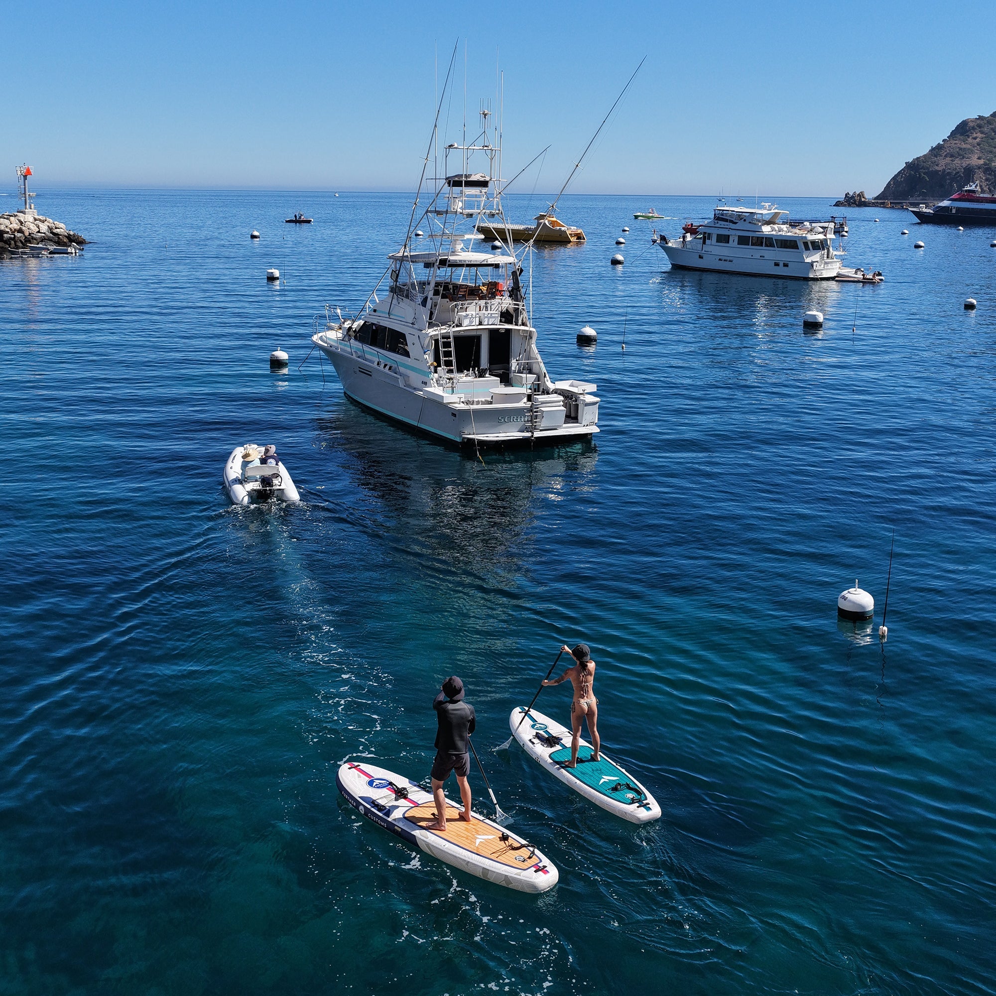 Aerial view of the 11'0 Avalon Emerald paddleboard by Further Customs in a harbor setting at Catalina Island.