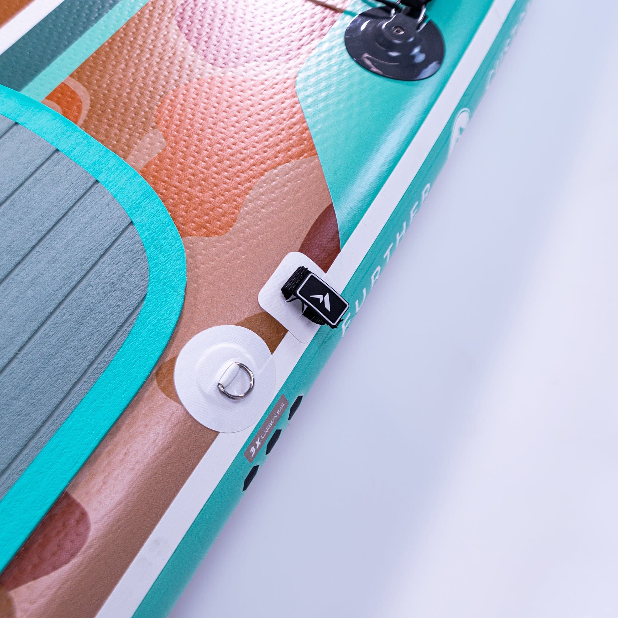 Further Customs 11'0 Tamarack Sage paddleboard with a fastener detail, showcasing the durable design and vibrant color.