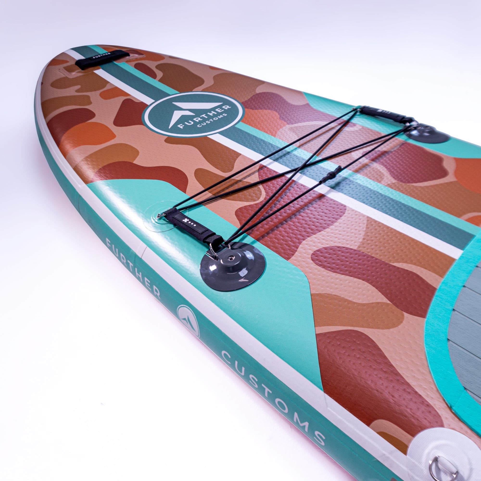Further Customs 11'0 Tamarack Sage paddleboard shown from stern, featuring sleek design and green color for outdoor water adventures.