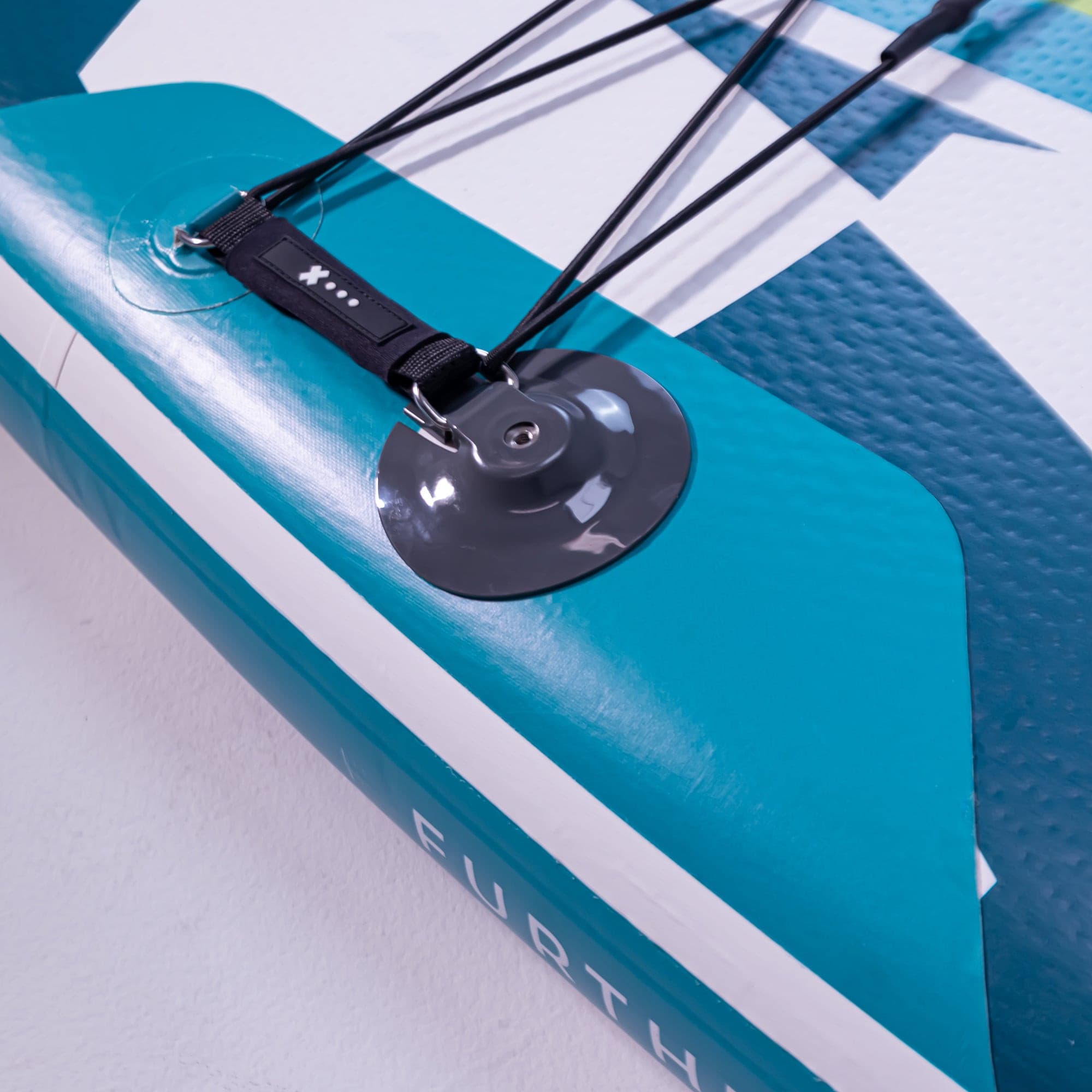 Further Customs 11'3 Podium turquoise paddleboard with action mount, showcasing its sleek design and durable construction.