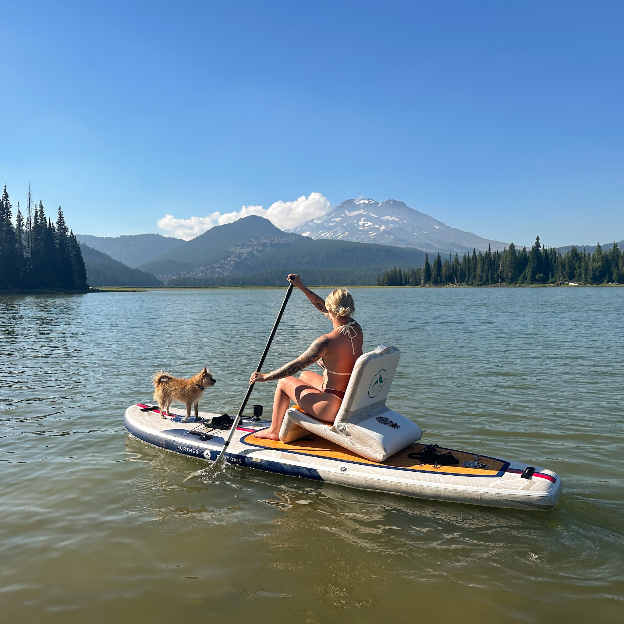 Further Customs inflatable skippers seat in a vibrant color, designed for canoe conversions and outdoor relaxation.